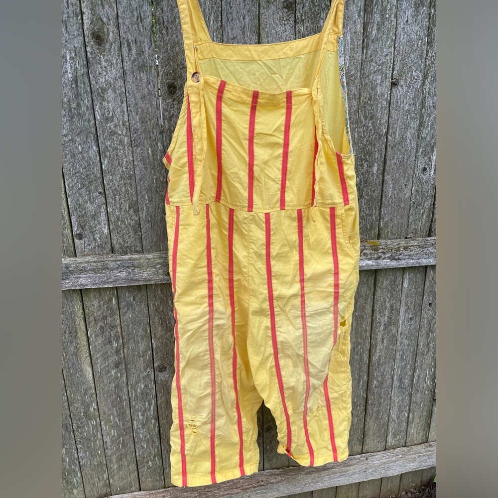 Yellow harem style overalls with red stripes